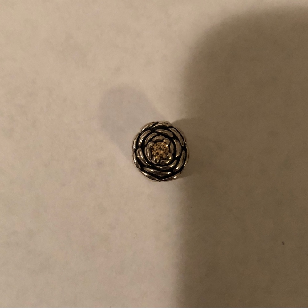 Pandora rose charm with gold stone jewel